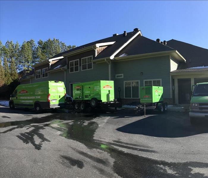 SERVPRO trucks in front of a residential job
